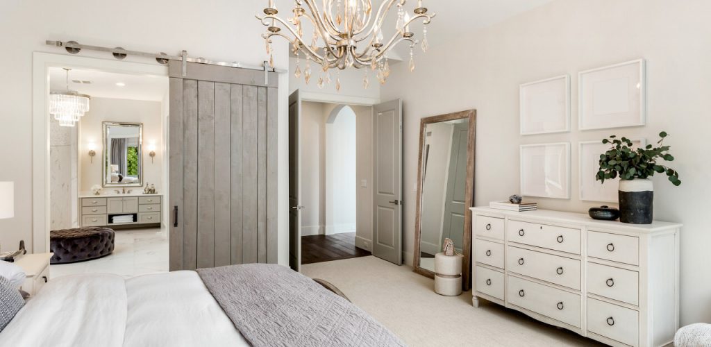 Beautiful master bedroom in new luxury home with view of ensuite bathroom.